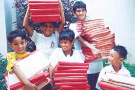 Photo: Students carrying Braille books