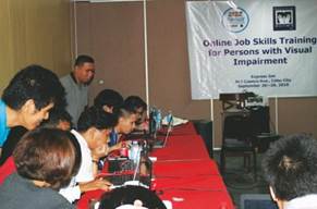 Photo:Students using laptop at online job skills training program