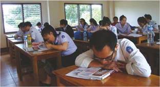 photo: visually impaired students sitting among their sighted peers in a classroom